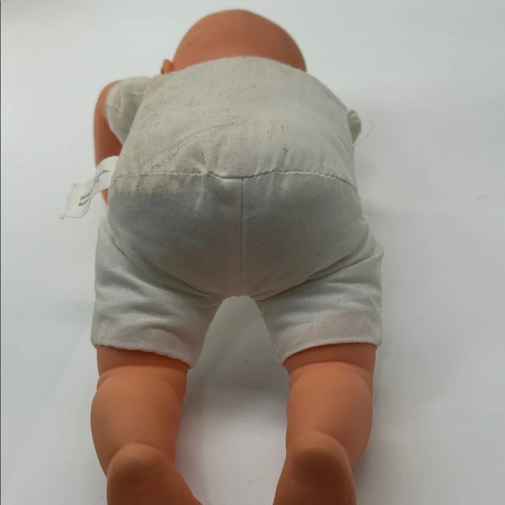 Realistic Baby Doll with White Outfit